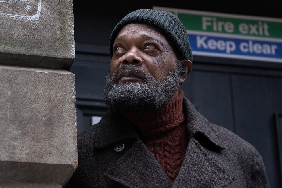 Nick Fury Secret Invasion Samuel L Jackson in Secret Invasion, wearing a beanie and leaning on a wall