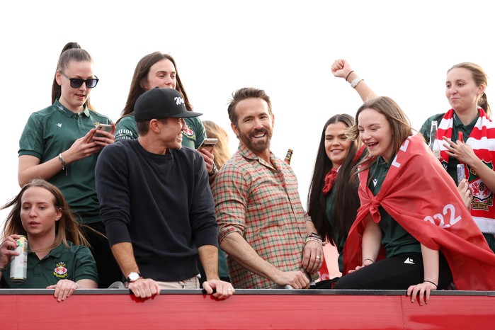 Rob McElhenney and Ryan Reynolds celebrate with Wrexham AFC fans Rob McElhenney and Ryan Reynolds celebrate with Wrexham AFC fans